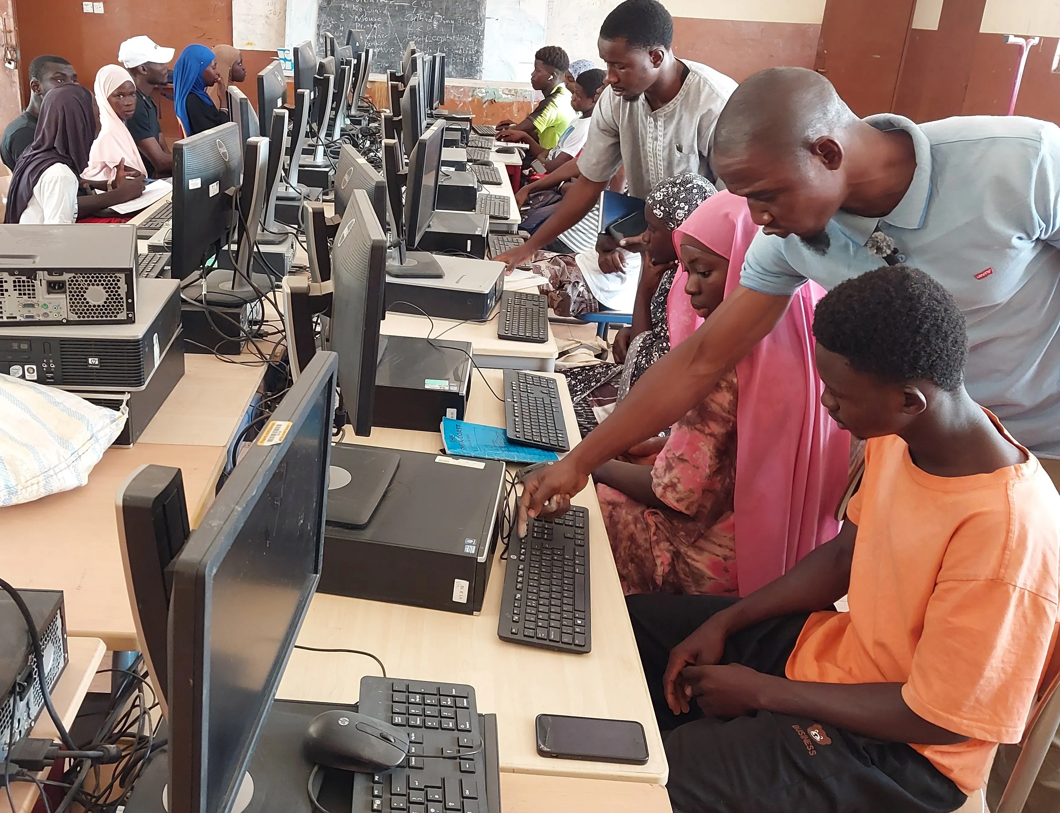 Students being trained at the TechForAll digital hub in Banjulinding, The Gambia