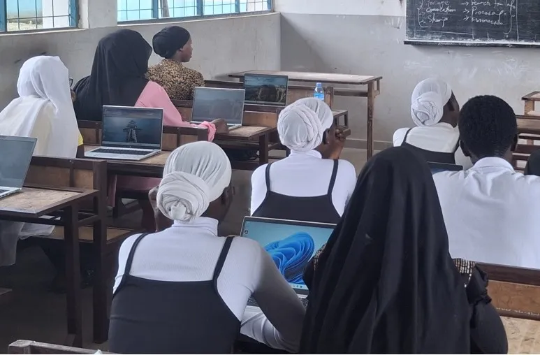 Young woman learning technology skills at TechForAll Foundation